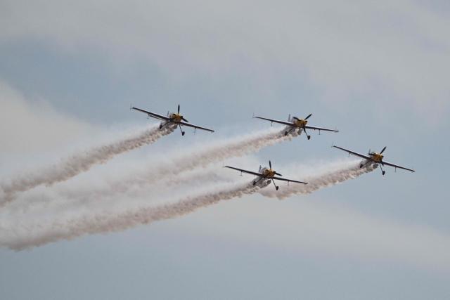 The Marksmen aerobatic team from South Africa performs during the Aero Asia 2025 in Zhuhai, in southern China's Guangdong province on November 27, 2025. Aero Asia 2025 is an international aviation and aerospace exhibition that runs between November 27 and 30. (Photo by Hector RETAMAL / AFP)