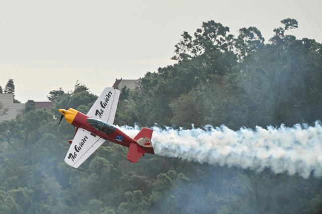 A plane of the Marksmen aerobatic team from South Africa performs during the Aero Asia 2025 in Zhuhai, in southern China's Guangdong province on November 27, 2025. Aero Asia 2025 is an international aviation and aerospace exhibition that runs between November 27 and 30. (Photo by Hector RETAMAL / AFP)