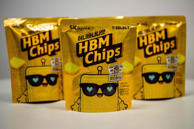 This photo illustration taken in Seoul on November 27, 2025 shows a general view of of packets of "HBM chips", or Honey Banana Mat -- Korean for "flavour" snack, a nod to South Korea's semiconductor giant SK hynix's top-selling high-bandwidth memory semiconductors. South Korea's semiconductor giant SK hynix has made a foray into a new genre of chips -- the kind that's crunchy and goes with a beer. (Photo by Anthony WALLACE / AFP)