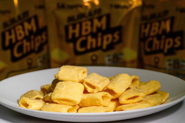 This photo illustration taken in Seoul on November 27, 2025 shows a general view of plated "HBM chips", or Honey Banana Mat -- Korean for "flavour" snack, a nod to South Korea's semiconductor giant SK hynix's top-selling high-bandwidth memory semiconductors. South Korea's semiconductor giant SK hynix has made a foray into a new genre of chips -- the kind that's crunchy and goes with a beer. (Photo by Anthony WALLACE / AFP)