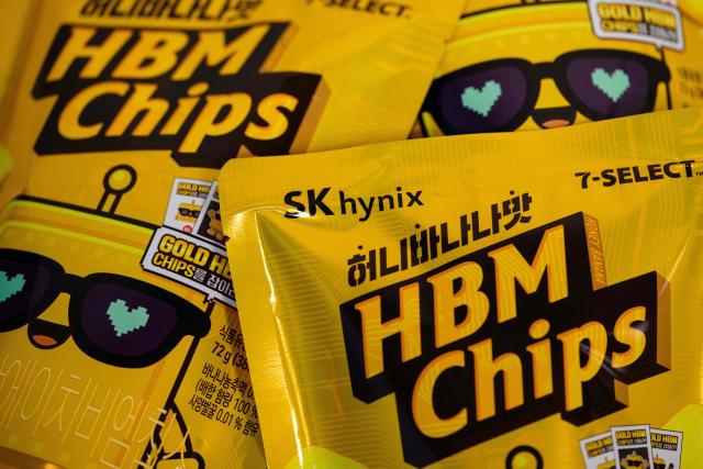 This photo illustration taken in Seoul on November 27, 2025 shows a general view of of packets of "HBM chips", or Honey Banana Mat -- Korean for "flavour" snack, a nod to South Korea's semiconductor giant SK hynix's top-selling high-bandwidth memory semiconductors. South Korea's semiconductor giant SK hynix has made a foray into a new genre of chips -- the kind that's crunchy and goes with a beer. (Photo by Anthony WALLACE / AFP)