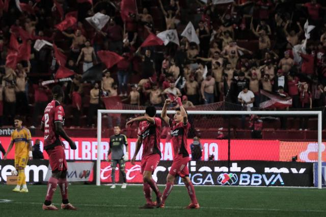 Tijuana's Mexican midfielder #19 Gilberto Mora (R) celebrates scoring his team's third goal during the first leg of the Liga MX Clausura quarterfinal match between Tijuana and Tigres at Caliente Stadium in Tijuana, Baja California State, Mexico, on November 26, 2025. (Photo by Guillermo Arias / AFP)