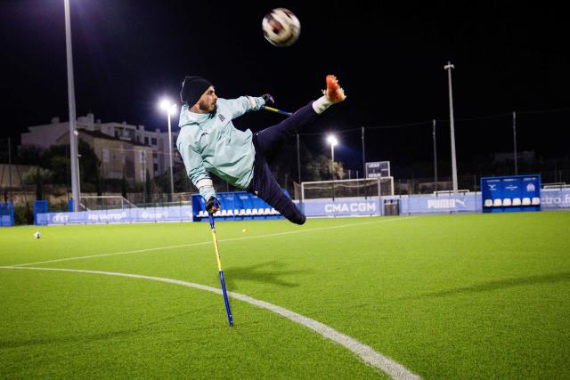 Billy Lunaschi of the Olympic de Marseille (OM) "Football for amputee" team takes part in a training session at the "OM Campus" in Marseille, southeastern France, on November 22, 2025. Accidents or illness may have taken a leg or a hand from them, but not their desire or joy to play football at a high level: on the weekend of November 29, 2025, OM's amputee team begins the French championship at home, dreaming of the Champions League. (Photo by CLEMENT MAHOUDEAU / AFP)