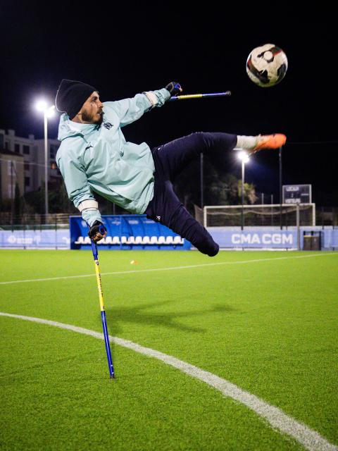 Billy Lunaschi of the Olympic de Marseille (OM) "Football for amputee" team takes part in a training session at the "OM Campus" in Marseille, southeastern France, on November 22, 2025. Accidents or illness may have taken a leg or a hand from them, but not their desire or joy to play football at a high level: on the weekend of November 29, 2025, OM's amputee team begins the French championship at home, dreaming of the Champions League. (Photo by CLEMENT MAHOUDEAU / AFP)