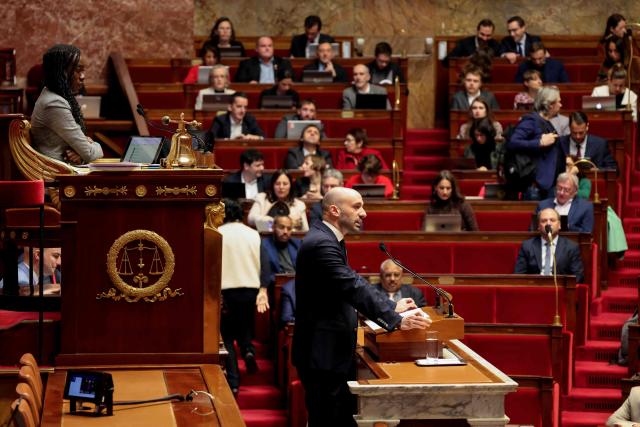La France Insoumise - Nouveau Front Populaire's MP and National Assembly vice-president Nadege Abomangoli (L) looks on as France's junior Minister in charge of Europe Benjamin Haddad (C) speaks during the opposition parliamentary time slot of French left-wing La France Insoumise (LFI) party at the French National Assembly, the French Parliament lower house, in Paris on November 27, 2025. (Photo by Ludovic MARIN / AFP)