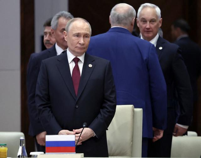 In this pool photograph distributed by the Russian state agency Sputnik, Russia's President Vladimir Putin attends a meeting of the Collective Security Treaty Organisation (CSTO) Heads of State Council at the Yntymak Ordo (Palace of Unity) presidential residence in Bishkek on November 27, 2025. (Photo by Alexander KAZAKOV / POOL / AFP)