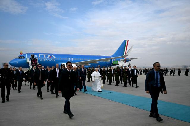 Pope Leo XIV disembarks from his plane after his arrival at Esenboga International Airport  in Ankara on November 27, 2025. Pope Leo XIV arrived in Turkey on the first overseas trip of his papacy, which will also take him to Lebanon. (Photo by OZAN KOSE / AFP)