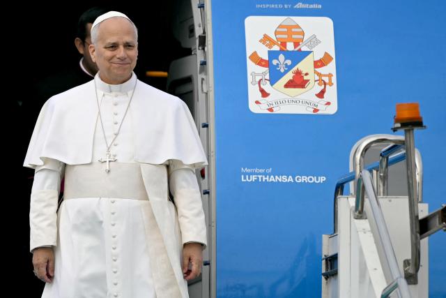 Pope Leo XIV disembarks from his plane after his arrival at Esenboga International Airport  in Ankara on November 27, 2025. Pope Leo XIV arrived in Turkey on the first overseas trip of his papacy, which will also take him to Lebanon. (Photo by Ozan KOSE / AFP)