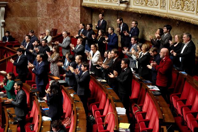 La France Insoumise - Nouveau Front Populaire's MPs applaud during the opposition parliamentary time slot of French left-wing La France Insoumise (LFI) party at the French National Assembly, the French Parliament lower house, in Paris on November 27, 2025. (Photo by Ludovic MARIN / AFP)