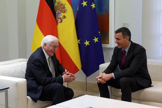 Spain's Prime Minister Pedro Sanchez (R) and Germany's President Frank-Walter Steinmeier laugh during a meeting at La Moncloa palace on the second day of his visit to Spain, in Madrid on November 27, 2025. (Photo by Pierre-Philippe MARCOU / AFP)