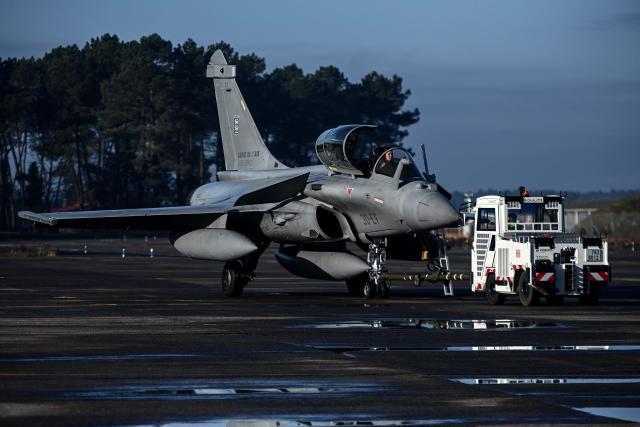 A Rafale fighter jet is driven to its station following a flight at a military air base during the Garuda 2025 French-Indian military cooperation exercise in Mont-de-Marsan, southwestern France, on November 26, 2025. (Photo by Christophe ARCHAMBAULT / AFP)