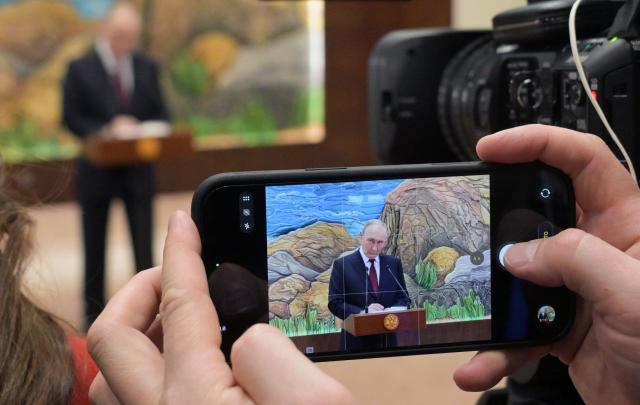 In this pool photograph distributed by the Russian state agency Sputnik, Russia's President Vladimir Putin meets with the Russian media in Bishkek on November 27, 2025. (Photo by Alexey NIKOLSKY / POOL / AFP)