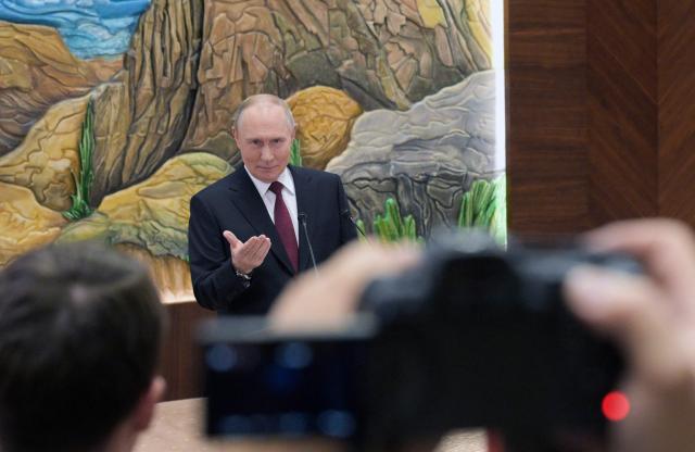 In this pool photograph distributed by the Russian state agency Sputnik, Russia's President Vladimir Putin meets with the Russian media in Bishkek on November 27, 2025. (Photo by Alexey NIKOLSKY / POOL / AFP)