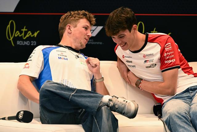Haas F1 Team's British driver Oliver Bearman (R) and Red Bull Racing's New Zealand driver Liam Lawson attend a press conference ahead of the Formula One Qatar Grand Prix at the Lusail International Circuit in Lusail on November 27, 2025. (Photo by Mahmud HAMS / AFP)