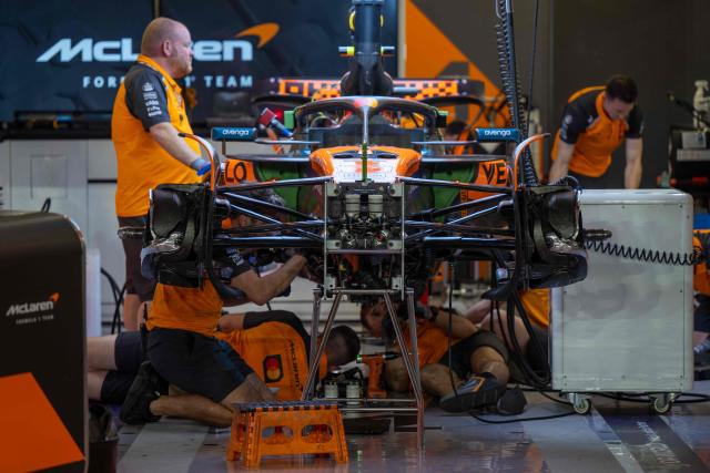 A mechanic works on the car of McLaren's British driver Lando Norris at the Lusail International Circuit ahead of the Formula One Qatar Grand Prix in Lusail on November 27, 2025. (Photo by Andrej ISAKOVIC / AFP)
