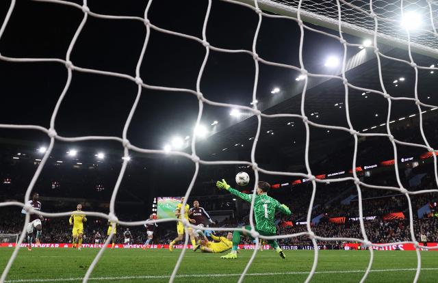 Aston Villa's Dutch defender #17 Donyell Malen (C) scores his team's second goal during the UEFA Europa League league-stage football match between Aston Villa and Young Boys at Villa Park in Birmingham on November 27, 2025. (Photo by DARREN STAPLES / AFP)