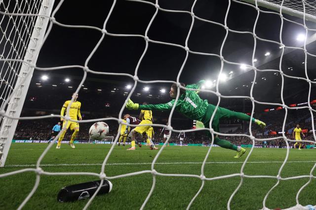 Aston Villa's Dutch defender  #17 Donyell Malen (C) scores his team's first goal during the UEFA Europa League league-stage football match between Aston Villa and Young Boys at Villa Park in Birmingham on November 27, 2025. (Photo by DARREN STAPLES / AFP)