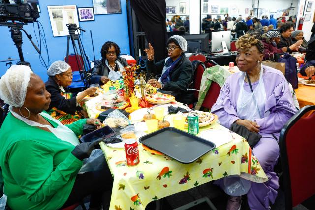 Gwen Carr (R), mother of Eric Garner sits at the National Action Network (NAN) Annual Thanksgiving Feeding event in Harlem, New York City, on Thanksgiving Day, November 27, 2025. (Photo by kena betancur / AFP)