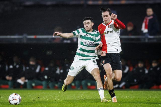 Celtic's Scottish defender #51 Colby Donovan (L) fights for the ball with Feyenoord's Slovak forward #16 Leo Sauer  during the UEFA Europa League football match Feyenoord Rotterdam and Celtic Glasgow at the Feyenoord Stadium 'De Kuip' in Rotterdam on Novemberr 27, 2025. (Photo by Koen van Weel / ANP / AFP)