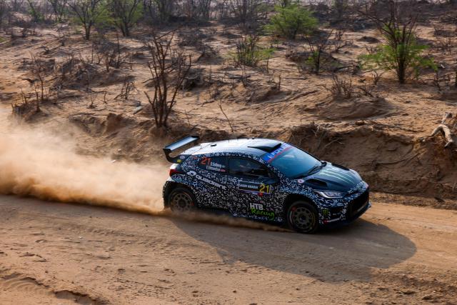 Printsport Team's Swedish Oliver Solberg and Co-driver British Elliott Edmondson compete in their Toyota GR Yaris during the second stage of the FIA World Rally Championship (WRC) in Jeddah on November 27, 2025. (Photo by Fayez Nureldine / AFP)