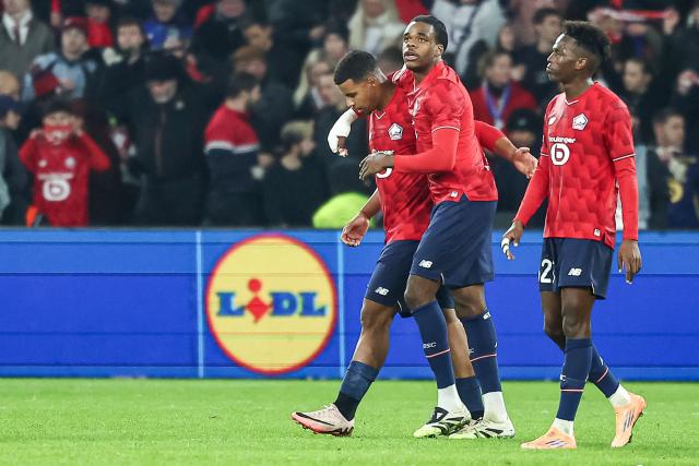 Lille's Moroccan forward #29 Hamza Igamane (L) celebrates with his teammates after scoring his team's third goal during the UEFA Europa League football match between Lille (LOSC) and GNK Dinamo Zagreb at the Pierre-Mauroy Stadium in Villeneuve-d'Ascq, northern France on November 27, 2025. (Photo by Sameer Al-DOUMY / AFP)