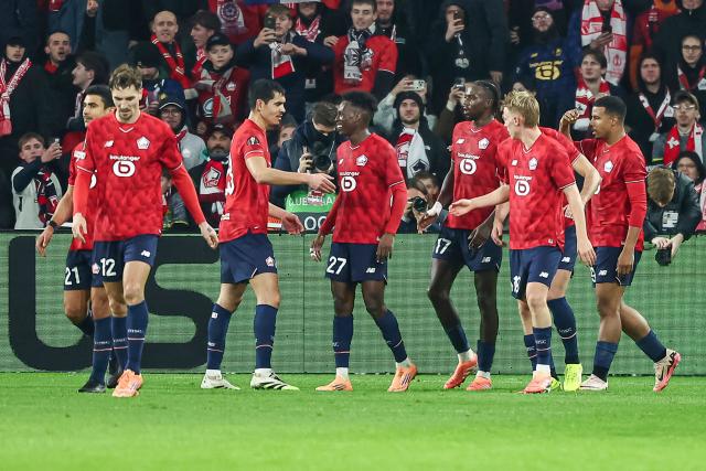 Lille's Moroccan forward #29 Hamza Igamane (R) celebrates with his teammates after scoring his team's third goal during the UEFA Europa League football match between Lille (LOSC) and GNK Dinamo Zagreb at the Pierre-Mauroy Stadium in Villeneuve-d'Ascq, northern France, on November 27, 2025. (Photo by Sameer Al-DOUMY / AFP)