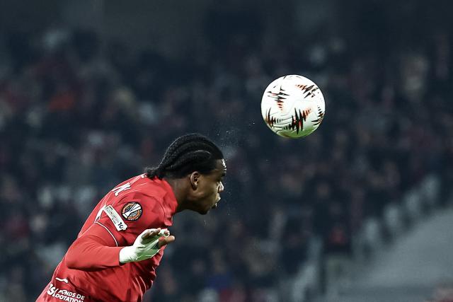 Lille's Belgian defender #03 Nathan Ngoy heads the ball during the UEFA Europa League football match between Lille (LOSC) and GNK Dinamo Zagreb at the Pierre-Mauroy Stadium in Villeneuve-d'Ascq, northern France on November 27, 2025. (Photo by Sameer Al-DOUMY / AFP)