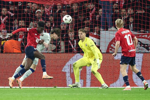 Dinamo Zagreb's Croatian defender #35 Noa Mikic (2ndR) heads the ball during the UEFA Europa League football match between Lille (LOSC) and GNK Dinamo Zagreb at the Pierre-Mauroy Stadium in Villeneuve-d'Ascq, northern France on November 27, 2025. (Photo by Sameer Al-DOUMY / AFP)