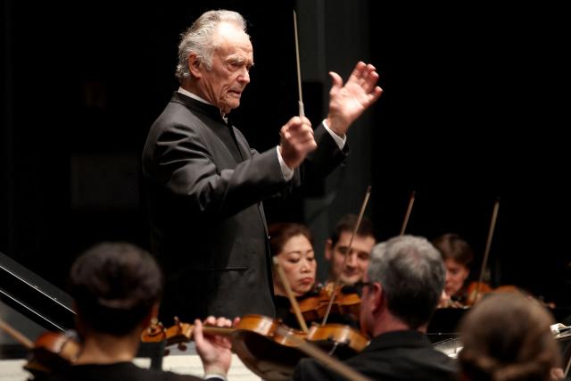 French founder of the Lille National Orchestra Jean-Claude Casadesus, nearing 90 years old, conducts a Mozart program in Lille's "Le Grand Sud" concert hall, on November 27, 2025. (Photo by Francois LO PRESTI / AFP)