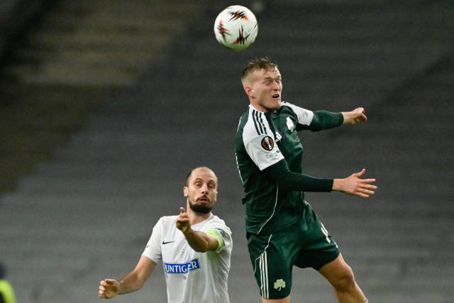 Panathinaikos' Polish forward #19 Karol Swiderski (R) fights for the ball with Sturm Graz's Slovenian midfielder #04 Jon Gorenc-Stankovic (L) during the UEFA Europa League football match between Panathinaikos FC and SK Sturm Graz at the Apostolos Nikolaidis Stadium in Athens on November 27, 2025. (Photo by Aris MESSINIS / AFP)
