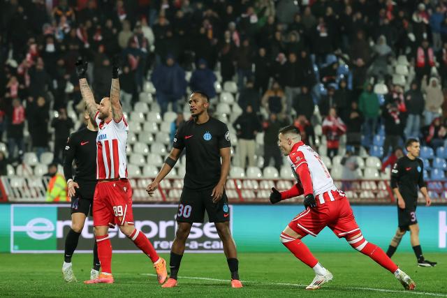 Crvena Zvezda's Brazilian forward #17 Bruno Duarte (R) celebrates after scoring a goal during the UEFA Europa League football match between FK Crvena zvezda and Fotbal Club FCSB at the Rajko Mitic Stadium in Belgrade on November 27, 2025. (Photo by Pedja MILOSAVLJEVIC / AFP)