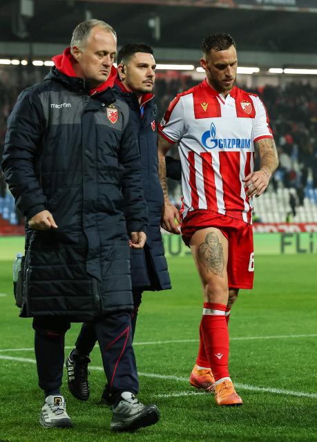 Crvena Zvezda Beograd's Austrian forward #89 Marko Arnautovic (R) sustains an injury during the UEFA Europa League football match between FK Crvena zvezda and Fotbal Club FCSB at the Rajko Mitic Stadium in Belgrade on November 27, 2025. (Photo by Pedja MILOSAVLJEVIC / AFP)