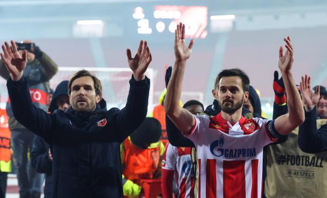 Crvena Zvezda's Serbian midfielder #10 Aleksandar Katai (L) and Crvena Zvezda's Montenegrin midfielder #04 Mirko Ivanic celebrate after winning the UEFA Europa League football match between FK Crvena zvezda and Fotbal Club FCSB at the Rajko Mitic Stadium in Belgrade on November 27, 2025. (Photo by Pedja MILOSAVLJEVIC / AFP)