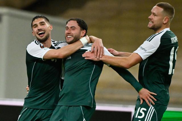 Panathinaikos' Italian defender #02 Davide Calabria (C) celebrates with teammates scoring his team's second goal during the  UEFA Europa League football match between Panathinaikos FC and SK Sturm Graz at the Apostolos Nikolaidis Stadium in Athens on November 27, 2025. (Photo by Aris MESSINIS / AFP)
