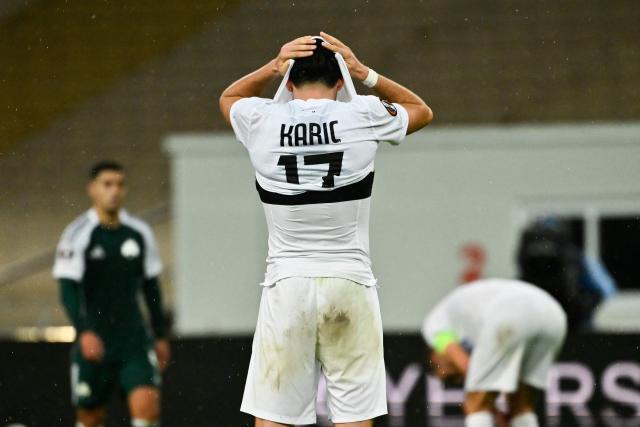 Sturm Graz's Austrian defender #17 Emir Karic reacts after the  UEFA Europa League football match between Panathinaikos FC and SK Sturm Graz at the Apostolos Nikolaidis Stadium in Athens on November 27, 2025. (Photo by Aris MESSINIS / AFP)