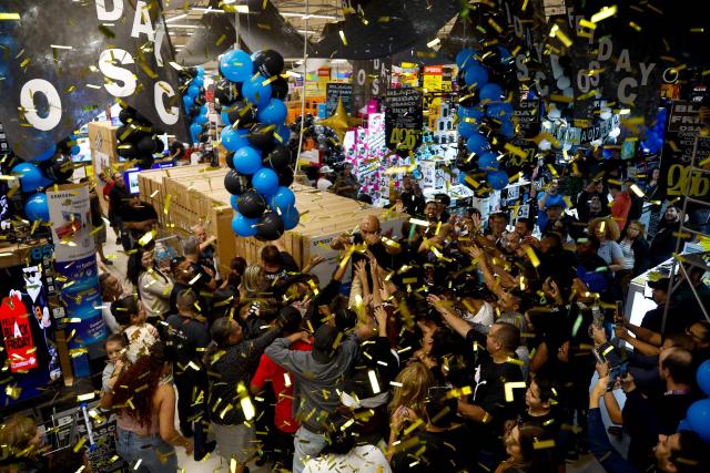 Shoppers buy during a Black Friday sale at a supermarket in Sao Paulo, Brazil on November 27, 2025. (Photo by Miguel SCHINCARIOL / AFP)