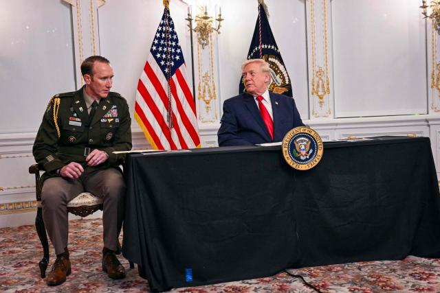 US President Donald Trump (R) speaks with US Army Lt. Col. Charlie Rockwood while participating in a video call with military service members from his Mar-a-Lago residence in Palm Beach, Florida, on November 27, 2025, during the Thanksgiving holiday. US President Donald Trump said Thursday that Sarah Beckstrom, one of the two National Guard troops shot a day earlier near the White House, had died, while the other soldier was "fighting for his life." (Photo by Jim WATSON / AFP)