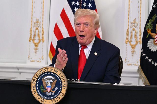 US President Donald Trump participates in a video call with military service members from his Mar-a-Lago residence in Palm Beach, Florida, on November 27, 2025, during the Thanksgiving holiday. US President Donald Trump said Thursday that Sarah Beckstrom, one of the two National Guard troops shot a day earlier near the White House, had died, while the other soldier was "fighting for his life." (Photo by Jim WATSON / AFP)