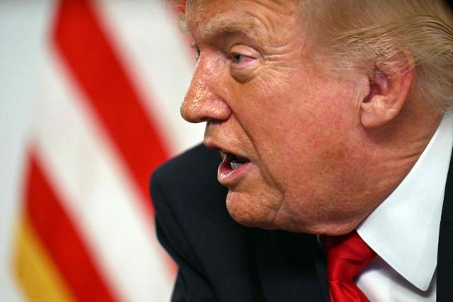 US President Donald Trump participates in a video call with military service members from his Mar-a-Lago residence in Palm Beach, Florida, on November 27, 2025, during the Thanksgiving holiday. US President Donald Trump said Thursday that Sarah Beckstrom, one of the two National Guard troops shot a day earlier near the White House, had died, while the other soldier was "fighting for his life." (Photo by Jim WATSON / AFP)