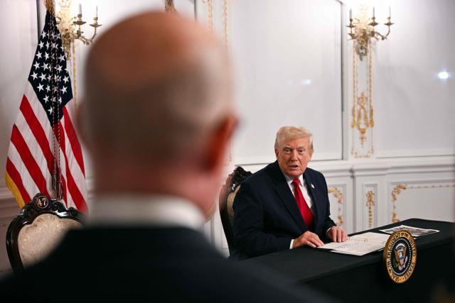 US President Donald Trump answers a question from a reporter while participating in a video call with military service members from his Mar-a-Lago residence in Palm Beach, Florida, on November 27, 2025, during the Thanksgiving holiday. US President Donald Trump said Thursday that Sarah Beckstrom, one of the two National Guard troops shot a day earlier near the White House, had died, while the other soldier was "fighting for his life." (Photo by Jim WATSON / AFP)