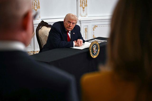 US President Donald Trump listens to a reporter's question while participating in a video call with military service members from his Mar-a-Lago residence in Palm Beach, Florida, on November 27, 2025, during the Thanksgiving holiday. US President Donald Trump said Thursday that Sarah Beckstrom, one of the two National Guard troops shot a day earlier near the White House, had died, while the other soldier was "fighting for his life." (Photo by Jim WATSON / AFP)
