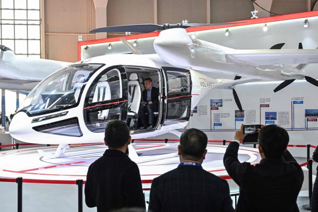 A Volant VE25-100 is seen at the Volant Aerotech booth during the Aero Asia 2025 in Zhuhai, in southern China's Guangdong province on November 28, 2025. Aero Asia 2025 is an international aviation and aerospace exhibition that runs between November 27 and 30. (Photo by Hector RETAMAL / AFP)