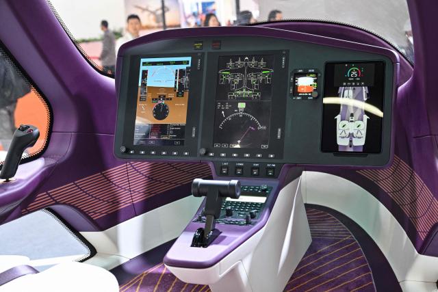 The cockpit of the LE200 eVTOL aircraft is seen at the Range Aviation booth during the Aero Asia 2025 in Zhuhai, in southern China's Guangdong province on November 28, 2025. Aero Asia 2025 is an international aviation and aerospace exhibition that runs between November 27 and 30. (Photo by Hector RETAMAL / AFP)