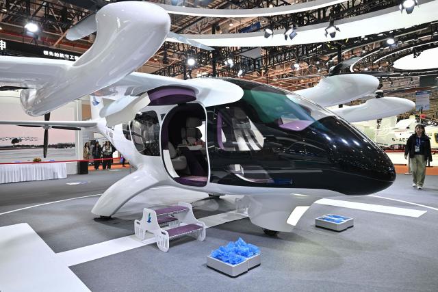 The LE200 eVTOL aircraft is seen at the Range Aviation booth during the Aero Asia 2025 in Zhuhai, in southern China's Guangdong province on November 28, 2025. Aero Asia 2025 is an international aviation and aerospace exhibition that runs between November 27 and 30. (Photo by Hector RETAMAL / AFP)