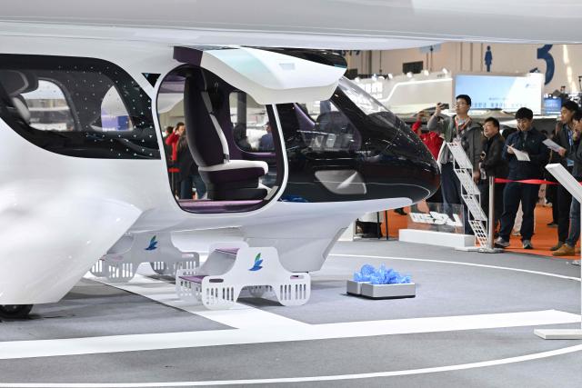The LE200 eVTOL aircraft is seen at the Range Aviation booth during the Aero Asia 2025 in Zhuhai, in southern China's Guangdong province on November 28, 2025. Aero Asia 2025 is an international aviation and aerospace exhibition that runs between November 27 and 30. (Photo by Hector RETAMAL / AFP)