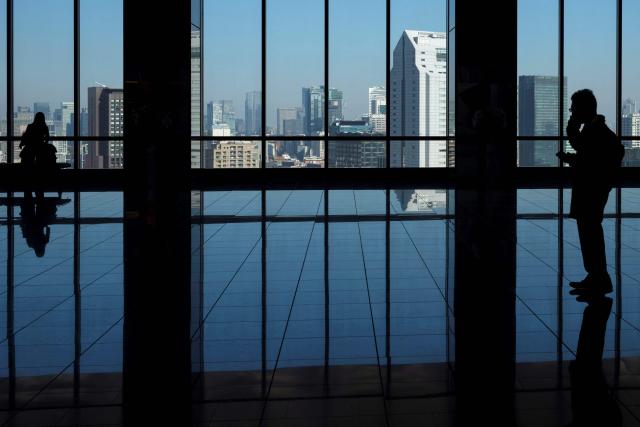 A view of Tokyo's skyscrapers is seen from the lobby of a high-rise building on November 28, 2025. (Photo by Kazuhiro NOGI / AFP)