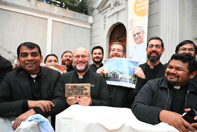 Clergymen wait for Pope Leo XIV outside the Cathedral of the Holy Spirit of Istanbul before a meeting and prayer with bishops, priests, deacons, consecrated men and women, and pastoral workers, on November 28, 2025. (Photo by Andreas SOLARO / AFP)
