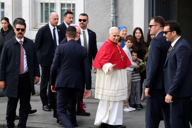 Pope Leo XIV arrives at the Cathedral of the Holy Spirit (St Esprit cathedral) for a meeting with bishops, priests, deacons, consecrated men and women, and pastoral workers , in Istanbul on November 28, 2025. (Photo by BERK OZKAN / AFP)