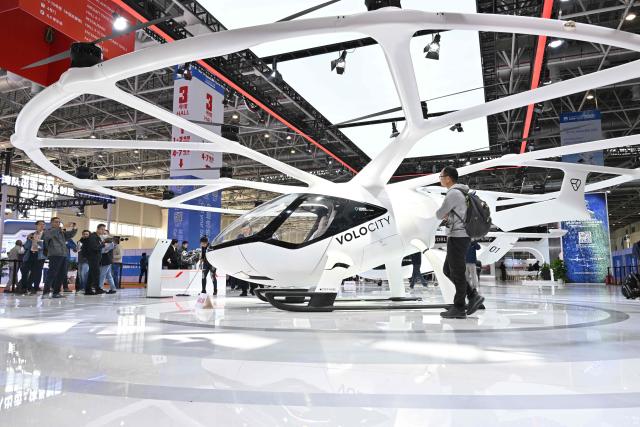 A Diamond VoloCity eVolt aircraft is seen in the Volocopter booth during the Aero Asia 2025 in Zhuhai, in southern China's Guangdong province on November 28, 2025. Aero Asia 2025 is an international aviation and aerospace exhibition that runs between November 27 and 30. (Photo by Hector RETAMAL / AFP)