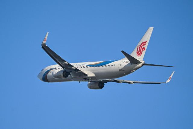 A Dalian Airlines Boeing 737-800 aircraft takes off from Zhuhai Jinwan Airport in Zhuhai, in southern China's Guangdong province on November 28, 2025. (Photo by Hector RETAMAL / AFP)